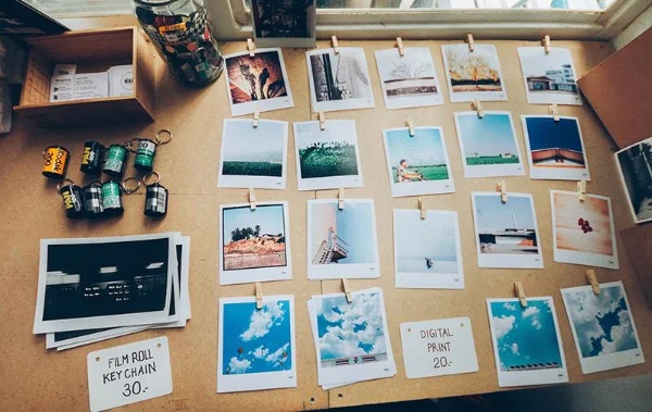 Photos hanging on a line showing proper display and organization methods